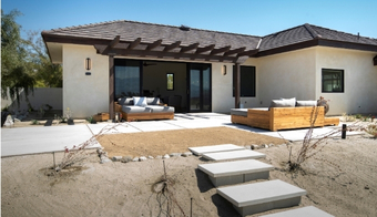 A home featuring a patio with furniture, promoting a 7-night stay at a Holistic Health SPA.