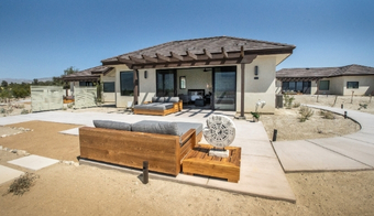 A home featuring a patio and wooden pergola, promoting a 7-night holistic detox program stay.