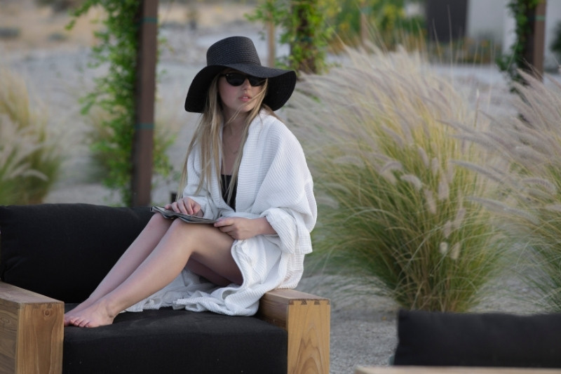 Woman relaxing at spa, highlighting need to clarify detox inclusions and add-ons