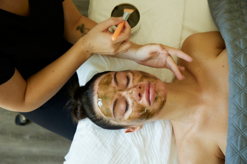 A relaxing facial therapy session focused on skin renewal, detoxification, and holistic self-care.