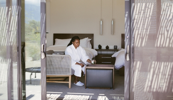 Palm Springs wellness resort room with guest relaxing for a peaceful 2-night retreat stay