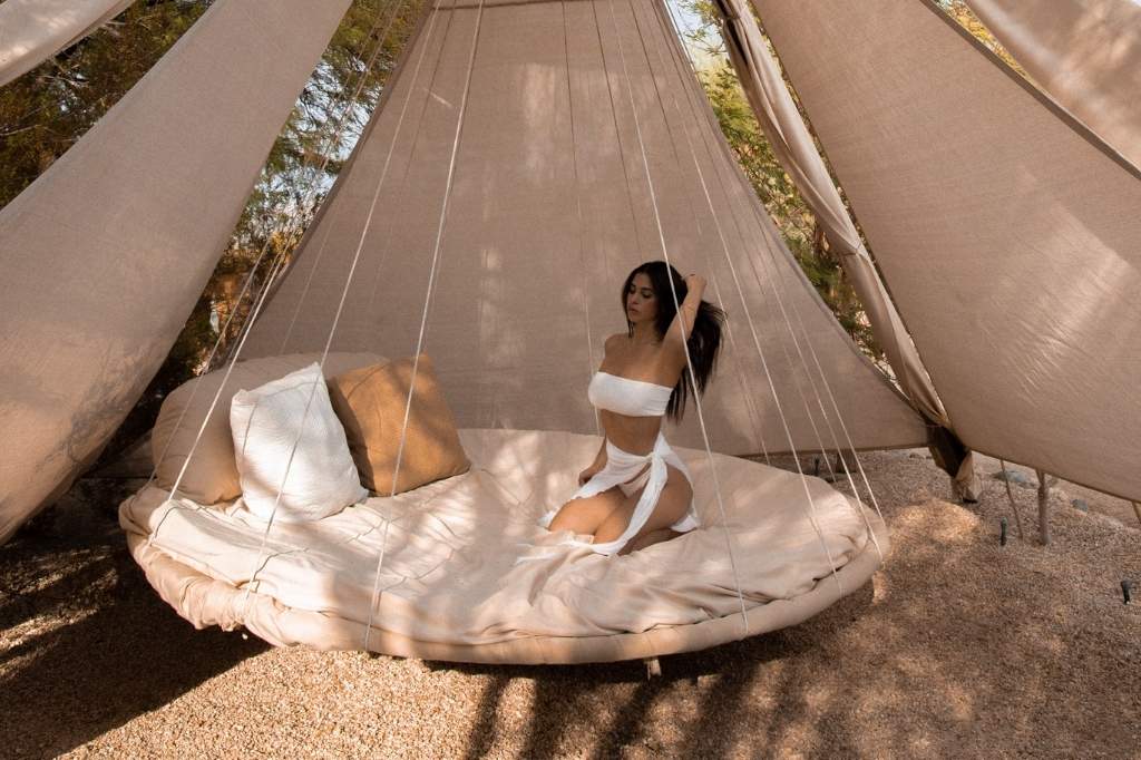 Relaxing outdoor lounge tent at California wellness retreat surrounded by peaceful nature