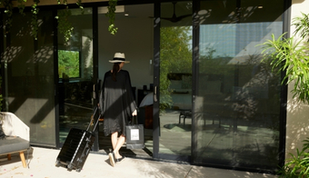 Guest arriving for a 7 night wellness retreat stay in California resort suite