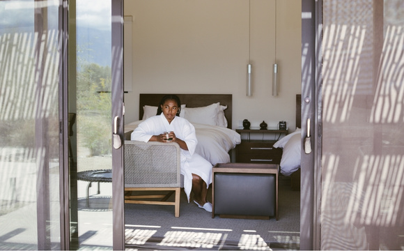 Guest relaxing in a private suite at a California wellness retreat resort