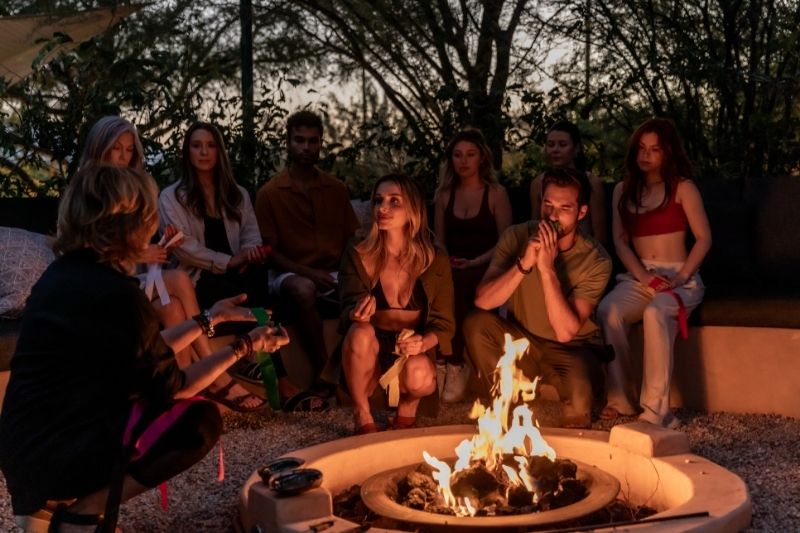 Retreat guests connect in a peaceful evening gathering designed to support relaxation and emotional wellness.