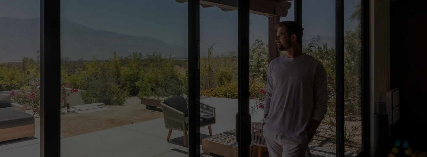 Guest enjoying scenic views from a private suite at a California fasting retreat