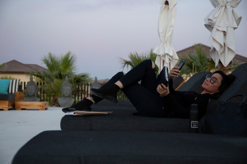 Woman relaxing at a wellness retreat to support menopause symptoms through guided fasting programs