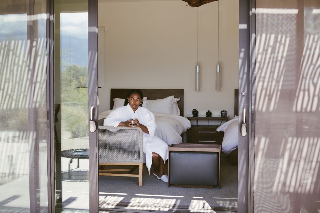 Guest relaxing in a robe inside a private room at We Care Spa in California