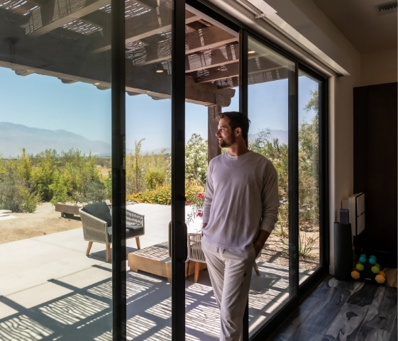 Guest enjoying mountain views from a private room at We Care Spa in California