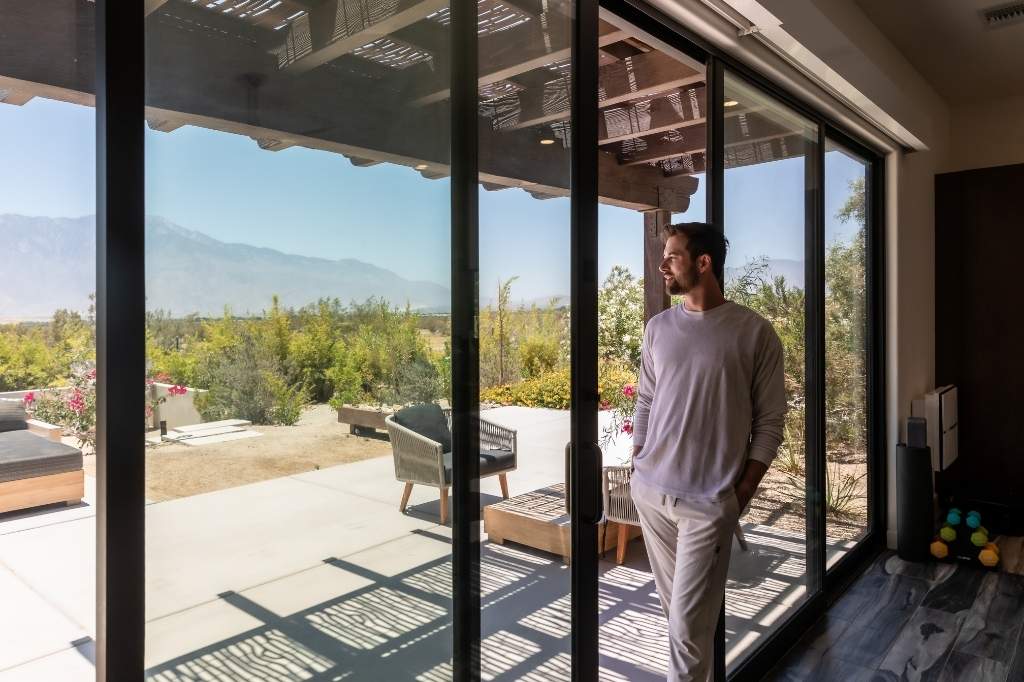 Guest enjoying mountain views at We Care Spa wellness retreat in California