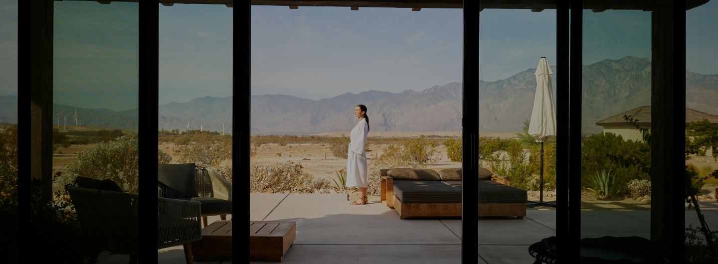 Guest enjoying desert mountain views at a palm springs luxury wellness retreat in We Care Spa