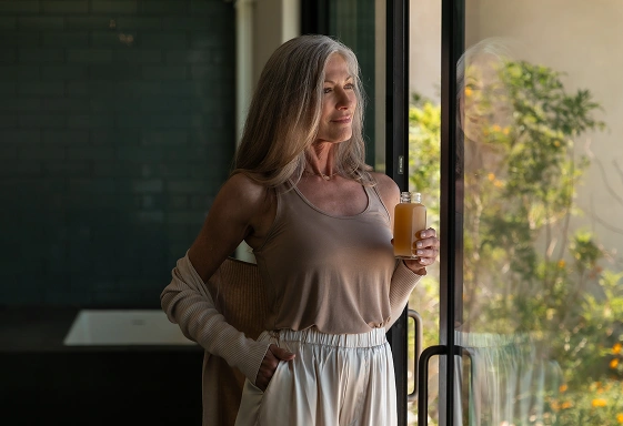 Guest enjoys a wellness juice at We Care Spa while supporting the body’s autophagy process