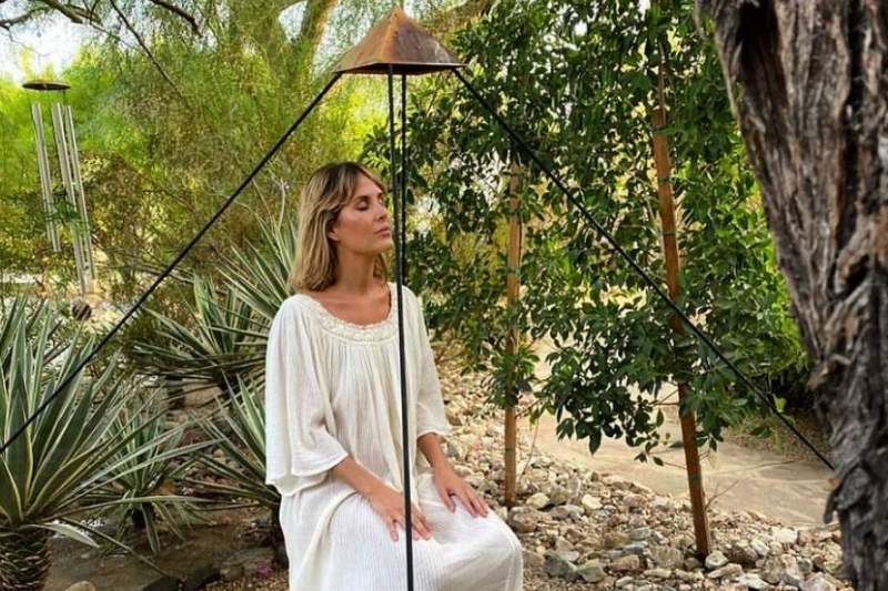 Guest meditates outdoors while preparing for a health detox retreat at We Care Spa