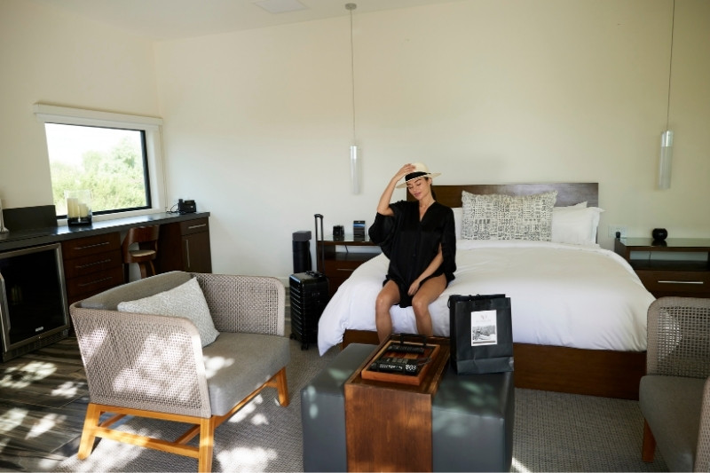 Guest arrives and settles into a comfortable room for a health detox retreat at We Care Spa