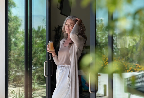 Guest enjoys a nutrient-rich wellness drink during a liquid detox retreat at We Care Spa