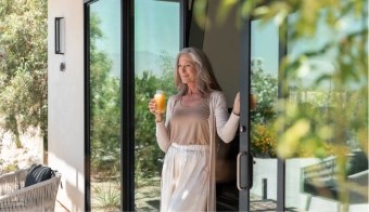 Guest enjoys a fresh wellness drink during a 7-night retreat stay at We Care Spa