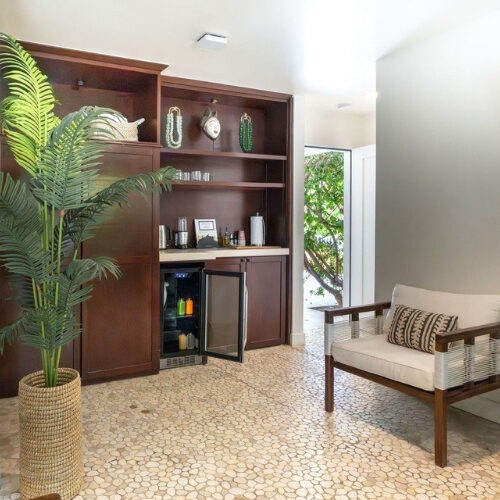 Club Suite sitting area with minibar and garden access at We Care Spa