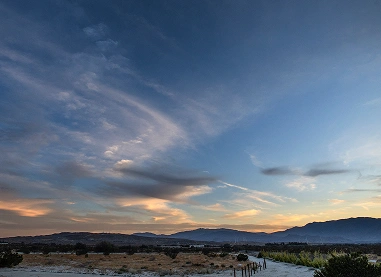Desert landscape at sunset near We Care Spa’s breathwork and holistic wellness retreat.