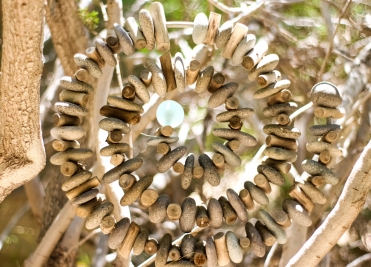 Decorative stone spiral sculpture in the garden at We Care Spa’s wellness retreat.