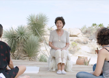 Wellness instructor leading a mindful discussion at We Care Spa’s holistic retreat.