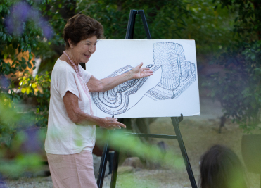 Wellness instructor explaining digestive health and gut recovery at We Care Spa.