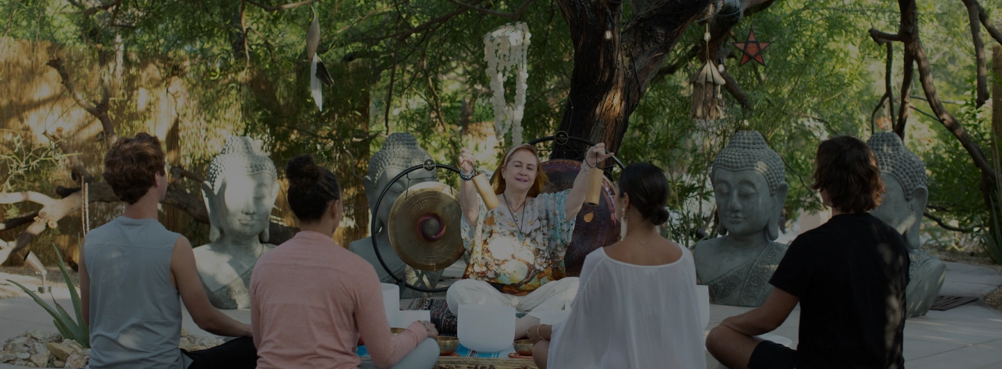 Group sound healing session with singing bowls and gongs at We Care Spa.