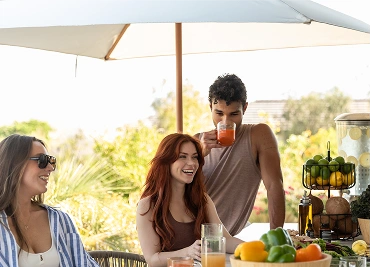 Guests enjoying fresh juices and healthy refreshments during nutritional guidance at We Care Spa.