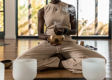 Sound healing session with singing bowl and incense at We Care Spa’s holistic wellness retreat.