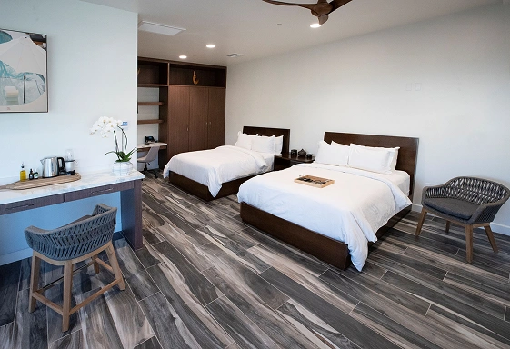 Premier Suite with two beds, seating area, and modern amenities at We Care Spa
