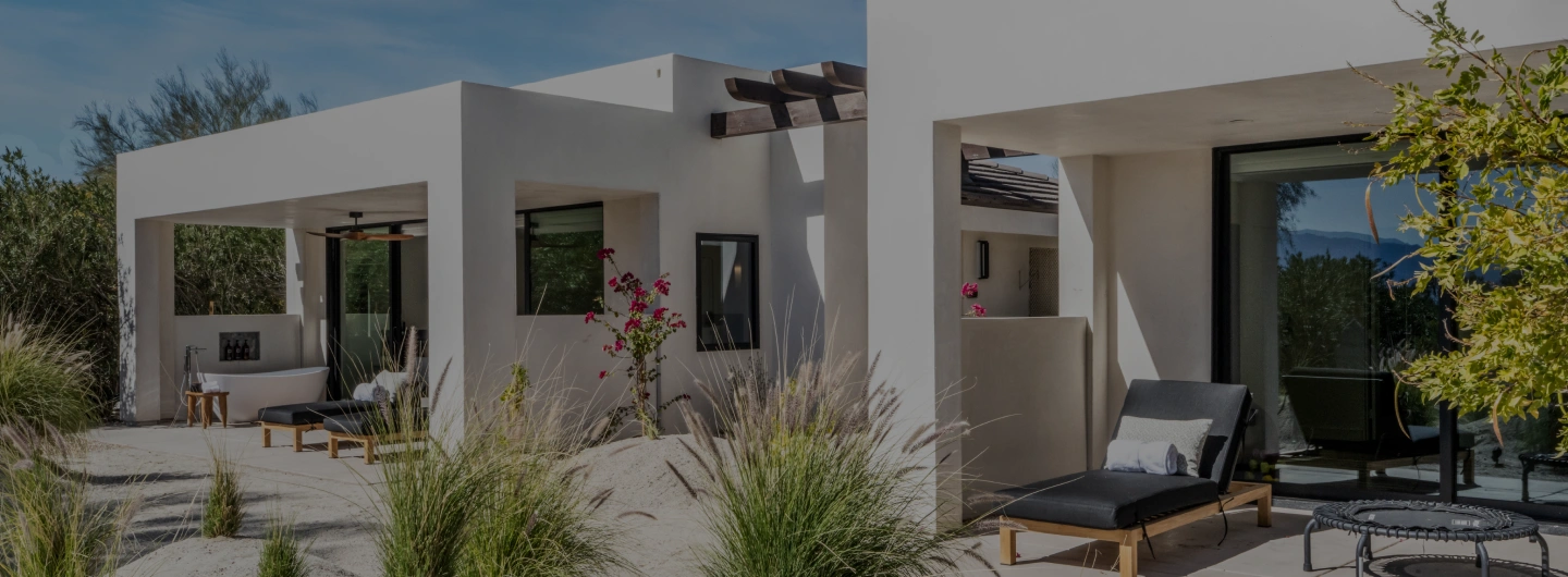 Private villas with outdoor soaking tubs and desert garden views at We Care Spa.