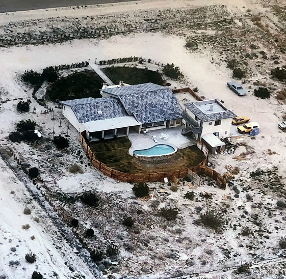 Historic aerial view of the original We Care Spa property and pool in the California desert.