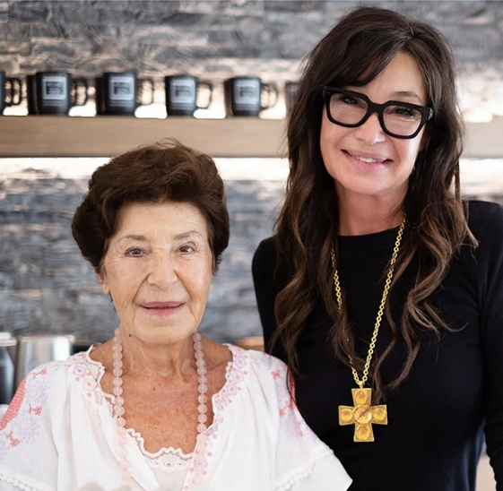 Two women together in a portrait highlighting the history and legacy of We Care Spa.