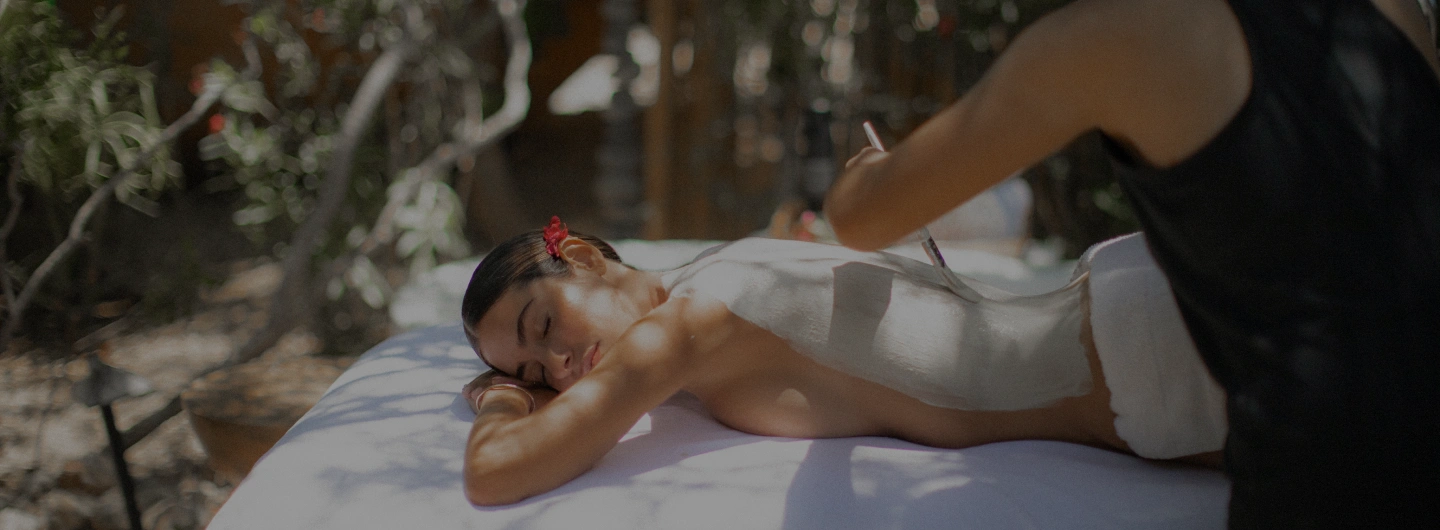 Guest receives a relaxing outdoor spa treatment as part of the detox experience at We Care Spa.